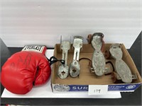 Old metal roller skates, ice skates, boxing glove
