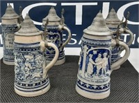 assortment of beer stein mugs