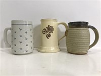 Three large ceramic mugs