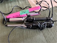 2 different sized curling irons and straightener