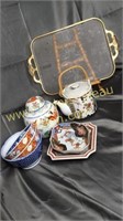 Group of oriental dishes on Jeanette harp tray