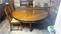 Antique walnut dining table with pads and 5