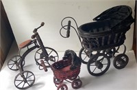 2 doll buggies and a tricycle