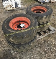 (4) 10-16.5 WIDE WALL FILLED BOBCAT TIRES