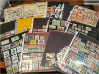 Large collection of vintage stamps in pages