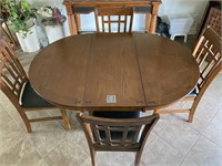 Rounded Dining Table, 4 Chairs, & 1 Leaf