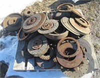 Pallet of parts including clutches, flywheels,