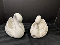 2 white decorative ceramic swans