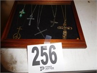 COLLECTION OF 7 CROSS NECKLACES IN A SHADOW BOX