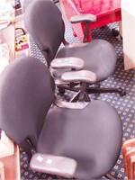 Two black rolling swivel office chairs; plus a