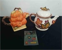 Two decorative fall teapots and some Halloween
