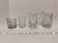 2 small pitchers measuring cup and glass