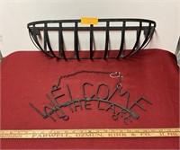 Wrought iron window basket and welcome sign