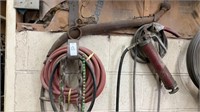 Wall lot of grease gun hose and chain