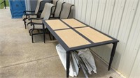 Patio table w/ 6 chairs, table has a cut in