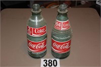 Two 2 Liter Coca Cola Bottles