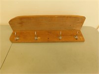 Wooden shelf with hooks 28 in long