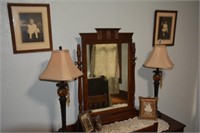 Two Ornate Table Lamps and Pictures On Wall