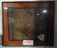 Lot #662 - Woven textile in frame. Measures