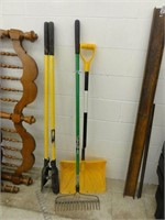 metal rake, plastic shovel, post hole digger
