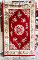 5' 3" x 8' 6" Red Chinese Sculptured Rug.