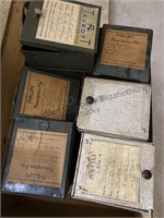 Two boxes of old prescription file tins.