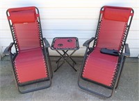 PAIR OF OUTDOOR LOUNGE CHAIRS AND TABLE