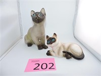 Two Enesco Ceramic Glazed Blue Eyed Siamese Cats