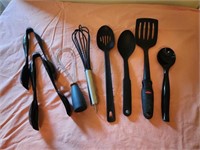 Assorted utensils, black spoons and spatulas