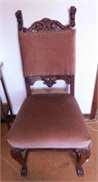 Antique carved oak lions head upholstered chair,