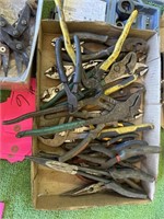 Approximately 20 pairs of pliers
