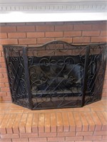 Black metal fireplace screen