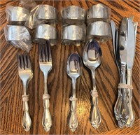 8 place setting flatware embossed with M or W