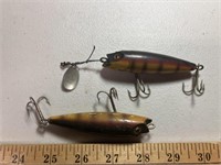 2 fishing lures ( possibly wood)