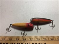 2 fishing lures ( possibly wood)