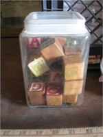 Jar of old wooden blocks