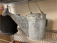 Galvanized water can