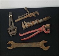 Old monkey wrench and other antique tools