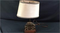 Vintage lamp with brass buggy