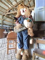 Life-size friendly scarecrow "Will work for