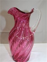 Hand blown cranberry swirled pitcher with applied