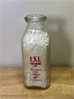 IXL Creamery Inc “Outgrow Your Need” Milk Bottle