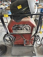 LINCOLN AC/DC ARC WELDER ON STAND