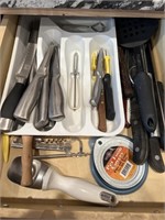 Lot of assorted knives and kitchen utensils.