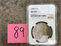 1884-O Morgan Dollar NGC MS62* some rainbow toning