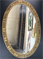 Oval shaped framed mirror. 30 1/2 x 21 in.