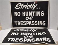 Pair of cardboard No Hunting or Trespassing signs
