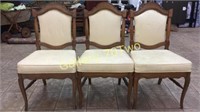 Antique oak chairs with tufted seats and