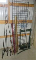 Assortment of fishing poles and related items