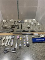 Assorted serving utensils and toddler eating